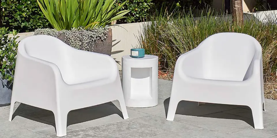Patio lounge setting with cushions and outdoor lighting