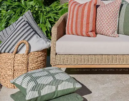 Outdoor cushions layered on a lounge setting