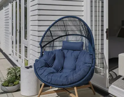 Outdoor occasional chair with a cushion