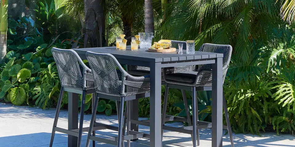 Courtyard with a dining setting and grouped pots