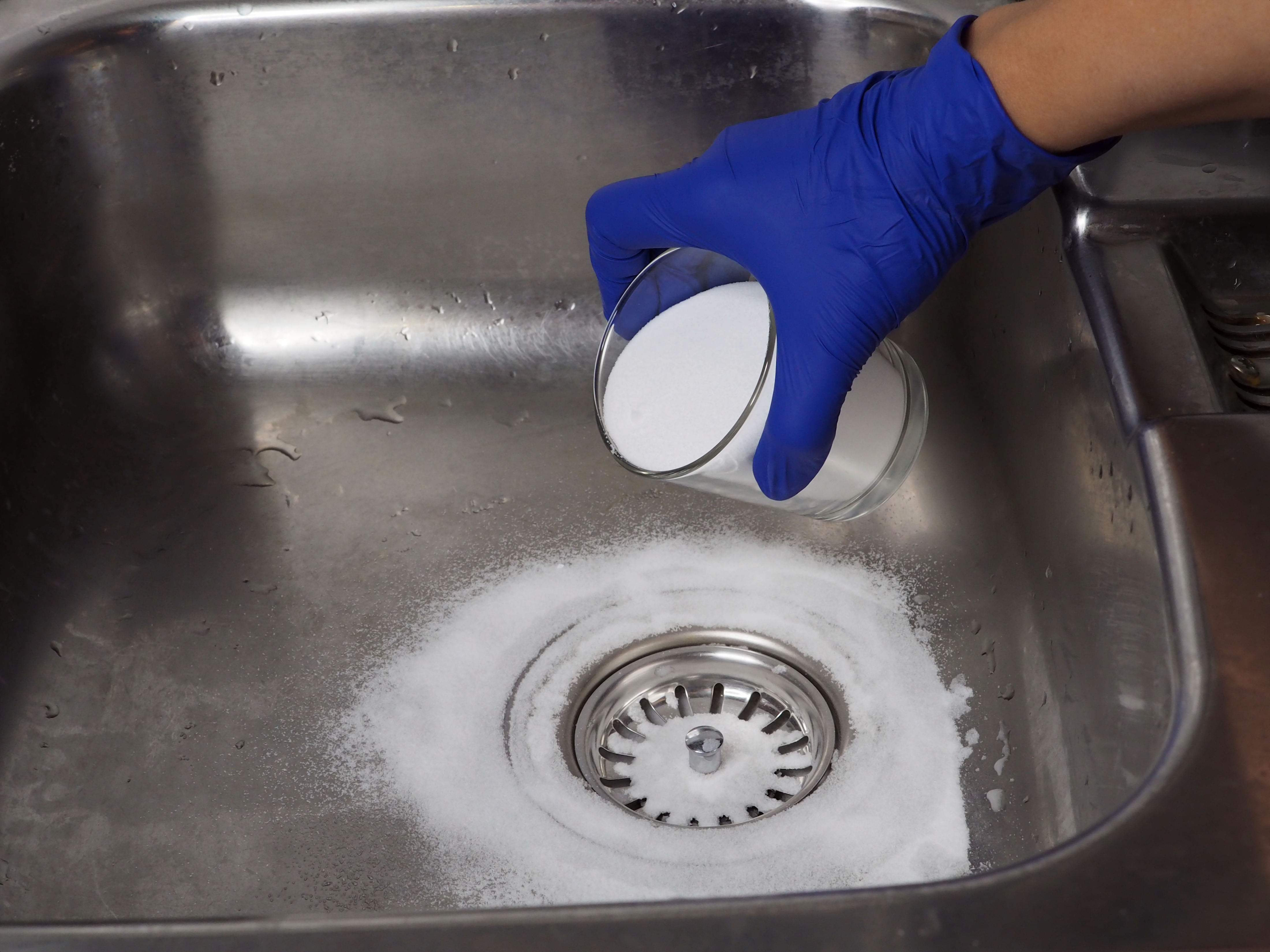 drain being cleaned