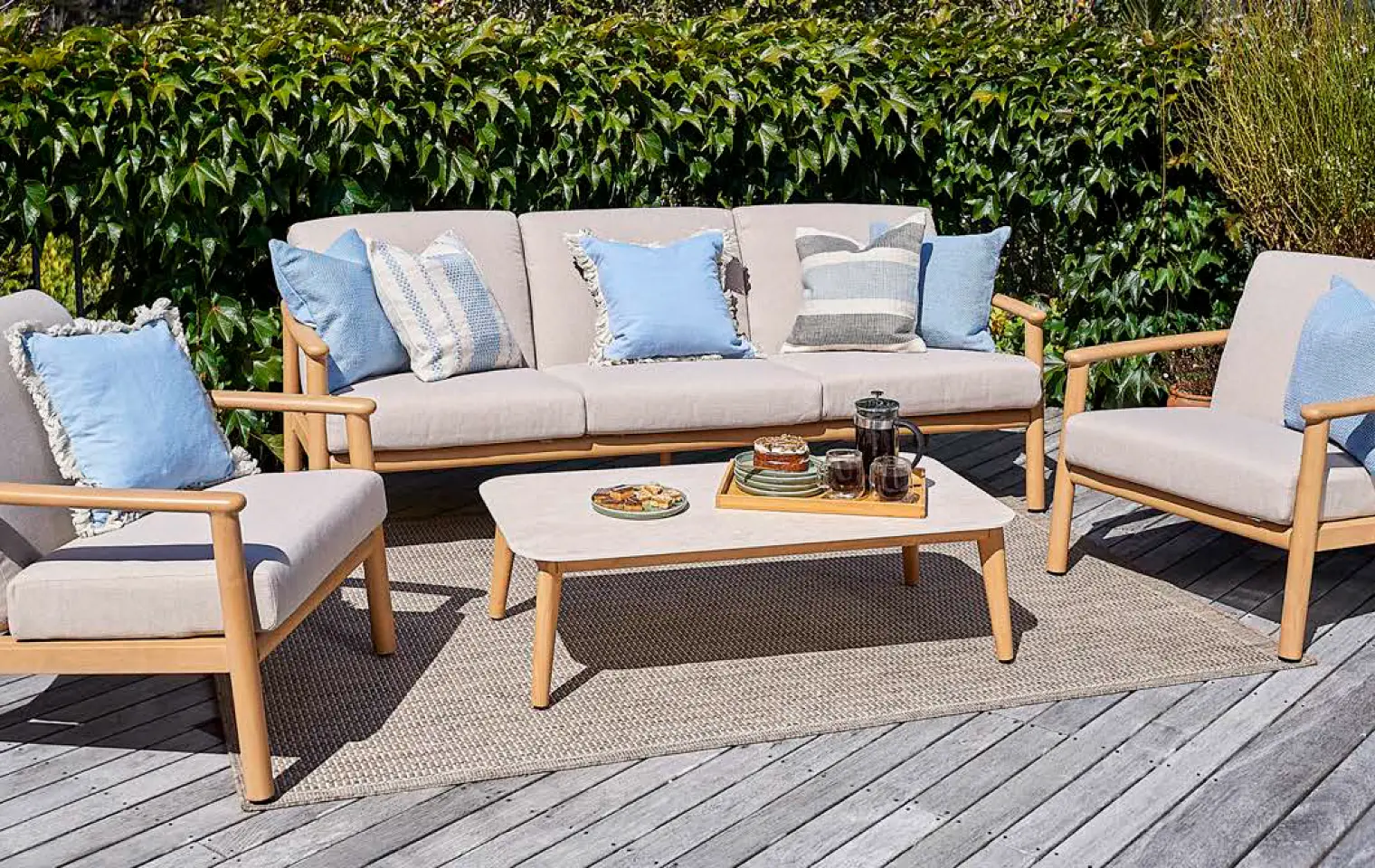 Small deck seating with cushions and a side table