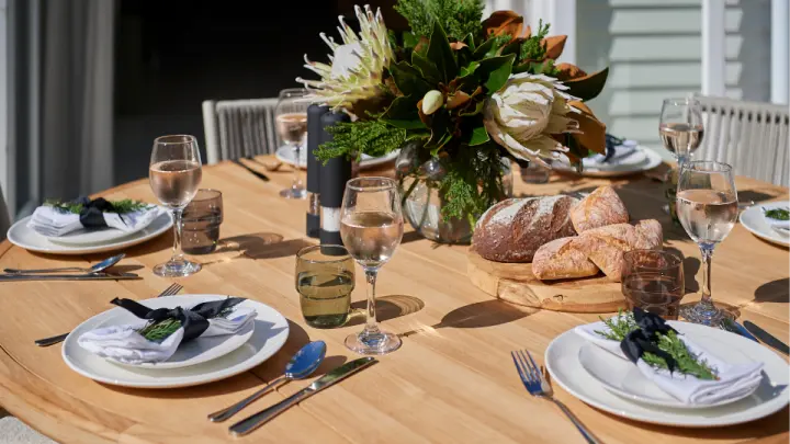 Outdoor table set with plates and glasses