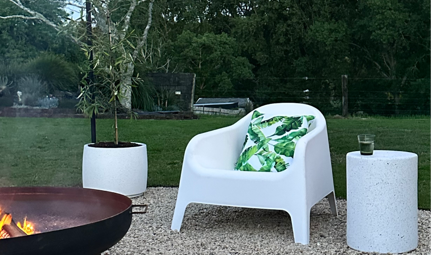 Outdoor rug and occasional chair on a small deck