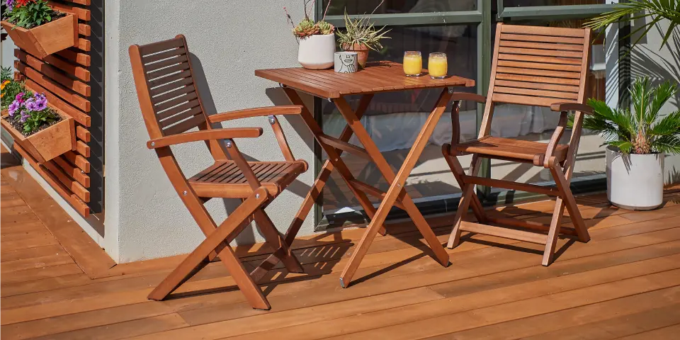 Deck lounge setting with cushions and outdoor lighting