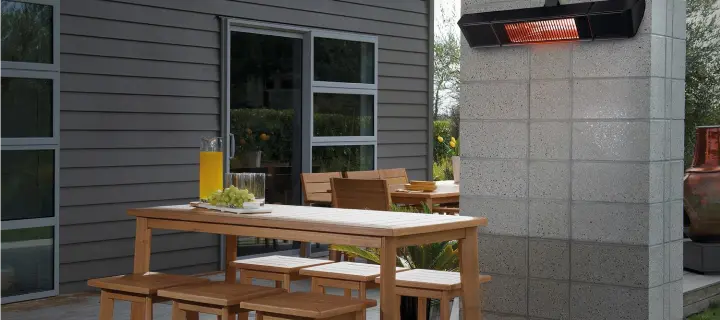 Outdoor radiant heater mounted above a dining area