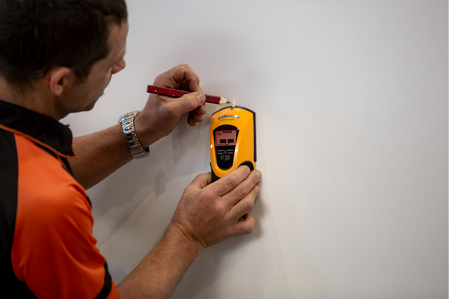 Stan using stud finder