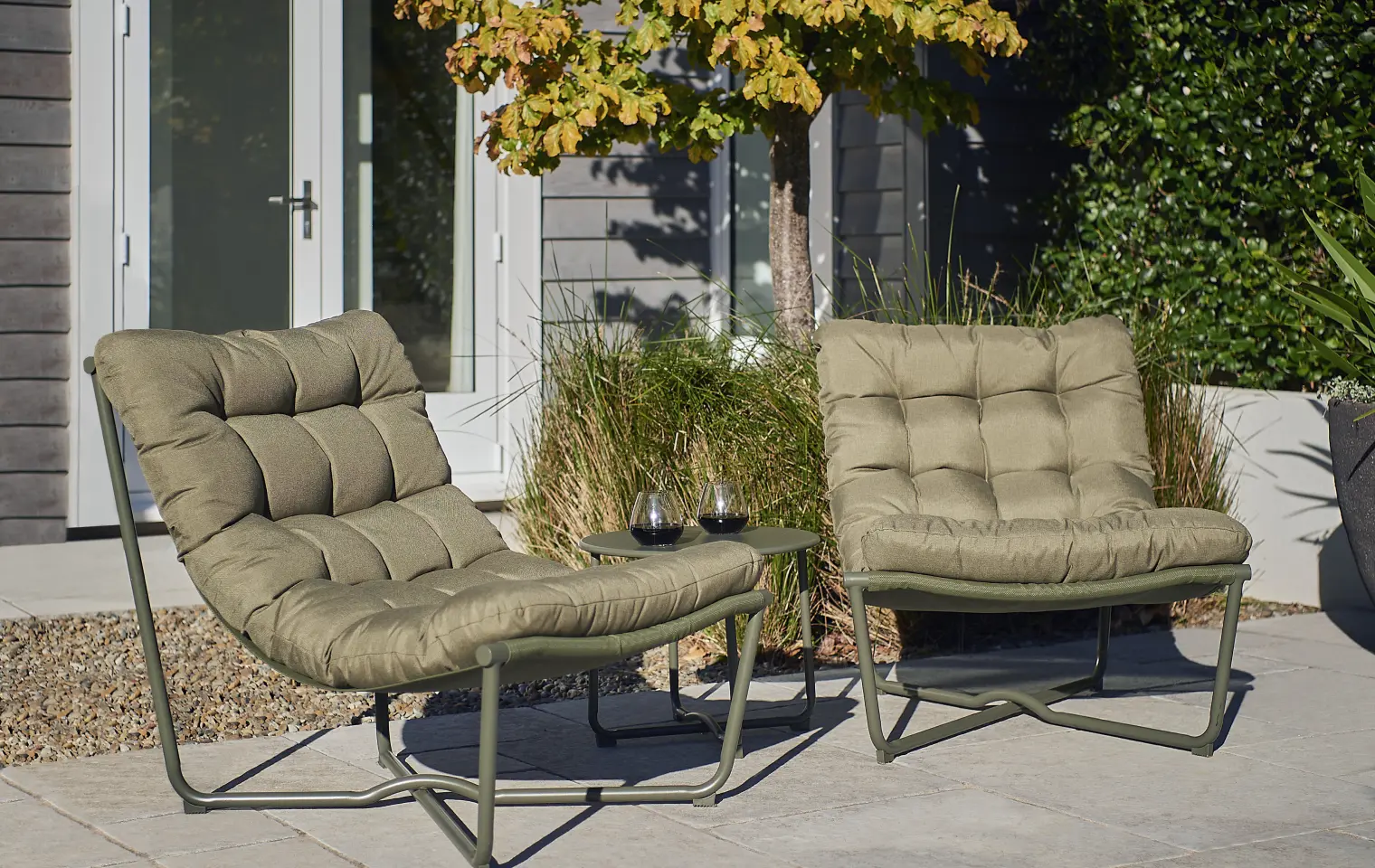 Courtyard seating with cushions and a side table