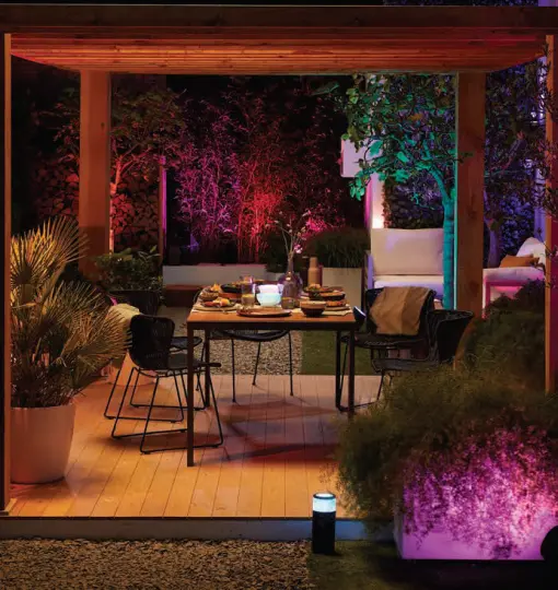 Warm festoon lights strung above an outdoor area